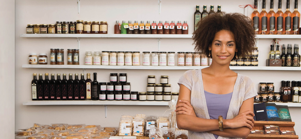 african american woman in front of a store shelf, small business, print, business solutions,