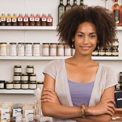 african american woman in front of store shelves, small business, women owned business